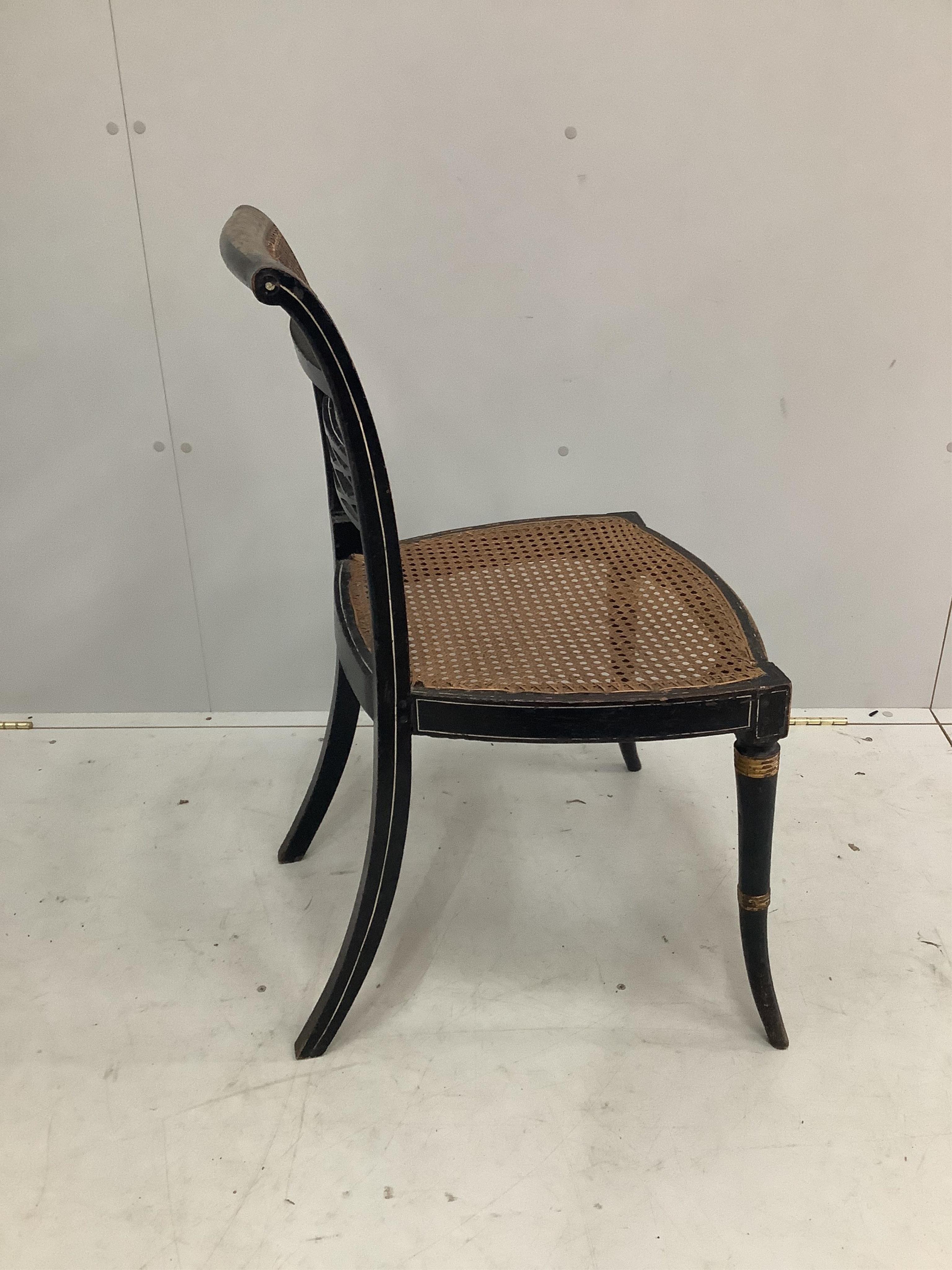 A Regency caned parcel gilt dining chair, width 48cm, depth 45cm, height 87cm. Condition - fair